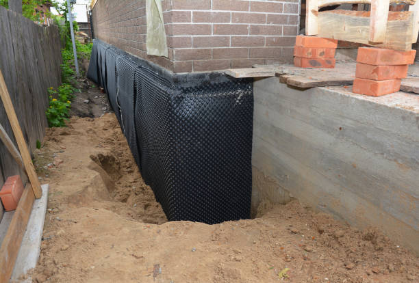 Happy homeowners after waterproofing job in Lakewood